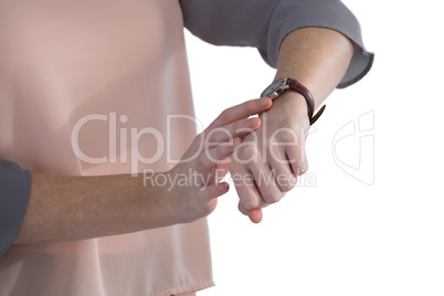 Female executive looking at wristwatch