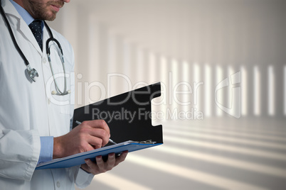 Composite image of mid-section of male doctor writing on clipboard