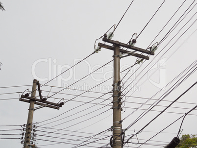 Posts with electric transmission wires on white background