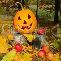pumpkin-head against of an autumn forest