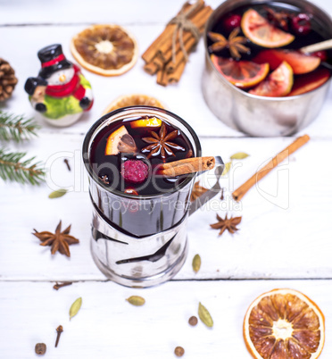 mulled wine in a glass with an iron cup holder