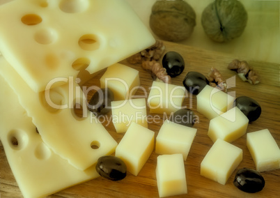 Cheese and walnuts on a plate.