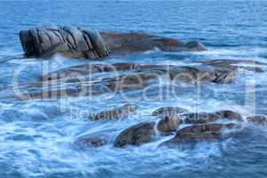 Beautiful sunrise in a bay with rocks in Costa Brava (Catalonia)