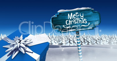 Merry Christmas and gift with Wooden signpost in Christmas Winter landscape