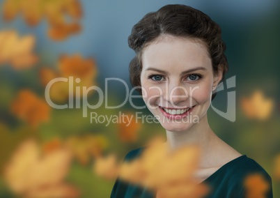Woman's face in nature with leaves