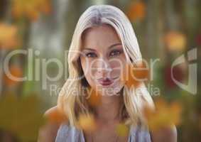 Woman's face in forest with leaves