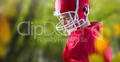 American football player full back in forest with leaves