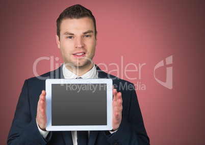 Man holding tablet with red background