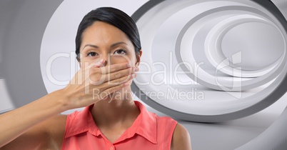 Woman holding hand over mouth in tunnel