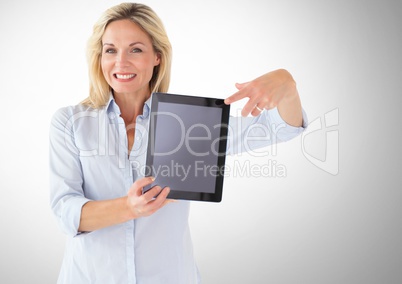 Woman holding tablet with grey background