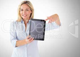 Woman holding tablet with grey background