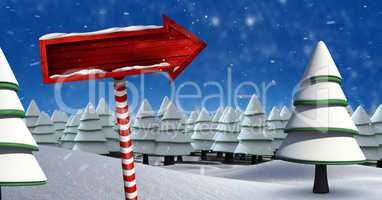 Wooden signpost in Christmas Winter landscape with trees