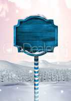 Wooden signpost in Christmas Winter landscape