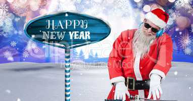 Happy New Year text and Santa DJ with Wooden signpost in Christmas Winter landscape