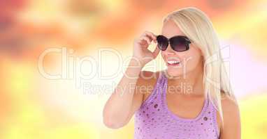 Woman with sunglasses and sun warm background