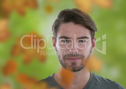 Man's face in forest with leaves