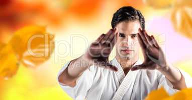 Man practicing martial arts face in forest