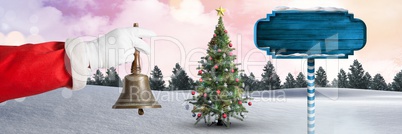 Santa holding bell and Wooden signpost in Christmas Winter landscape with Christmas tree