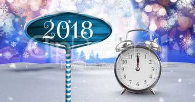 2018 Year and midnight clock with Wooden signpost in Christmas Winter landscape