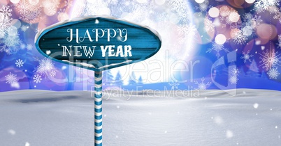 Happy New Year text on Wooden signpost in Christmas Winter landscape