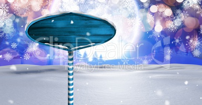 Wooden signpost in Christmas Winter landscape