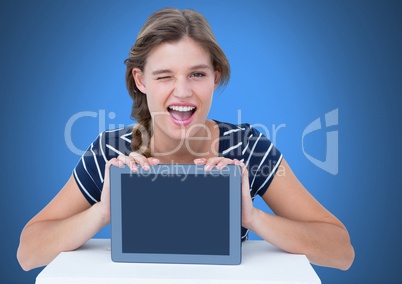 Woman holding tablet with blue background