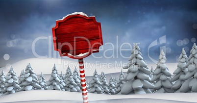 Wooden signpost in Christmas Winter landscape