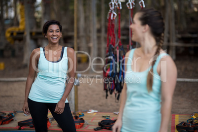 Friends interacting with each other in forest