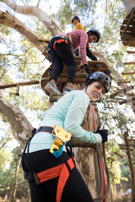 Friends climbing on tree with stairs