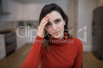 Portrait of beautiful woman suffering from headache