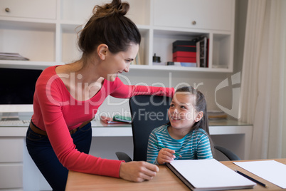 Mother and daughter interacting with each other