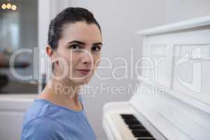 Portrait beautiful woman playing piano