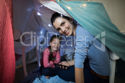 Mother and daughter playing at home