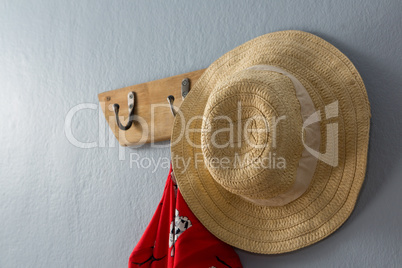 Dress and hat hanging on hook