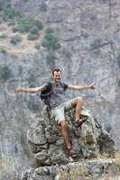 male backpacker showing thumbs up