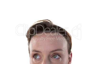 Woman looking away against white background