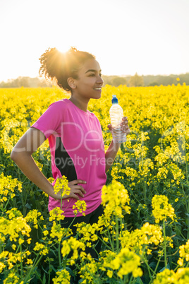 Mixed Race African American Girl Teenager Runner Drinking Water
