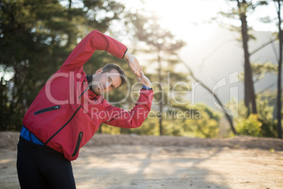 Portrait of man exercising in park