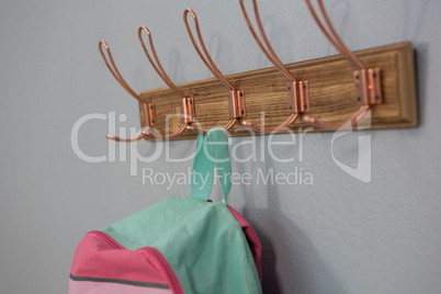 Schoolbag hanging on hook