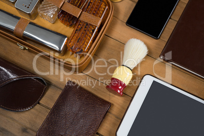 Various accessories arranged on wooden plank