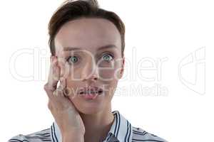 Female executive standing against white background