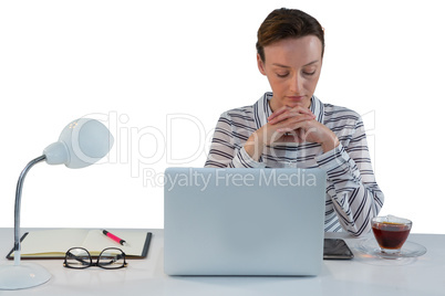 Upset female executive sitting at desk