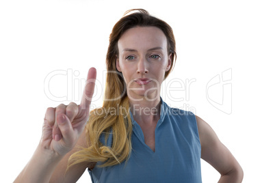 Female executive pretending to use an invisible screen