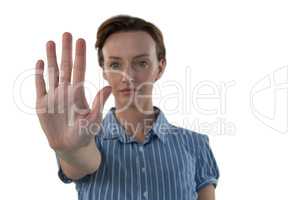 Female executive pretending to use an invisible screen