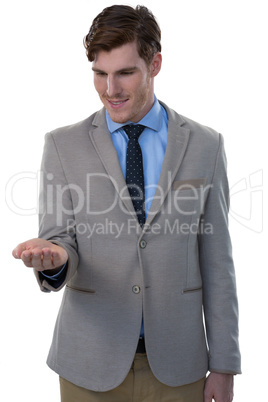 Businessman pretending to hold an invisible object