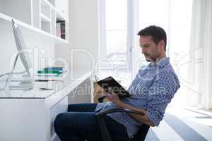 Man reading organizer