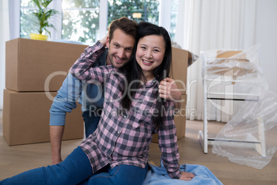 Couple relaxing at their new house