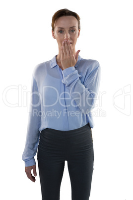 Female executive covering her mouth