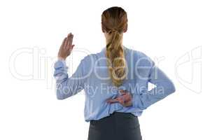 Female executive gesturing against white background