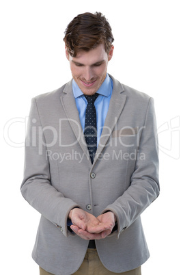 Businessman pretending to hold an invisible object